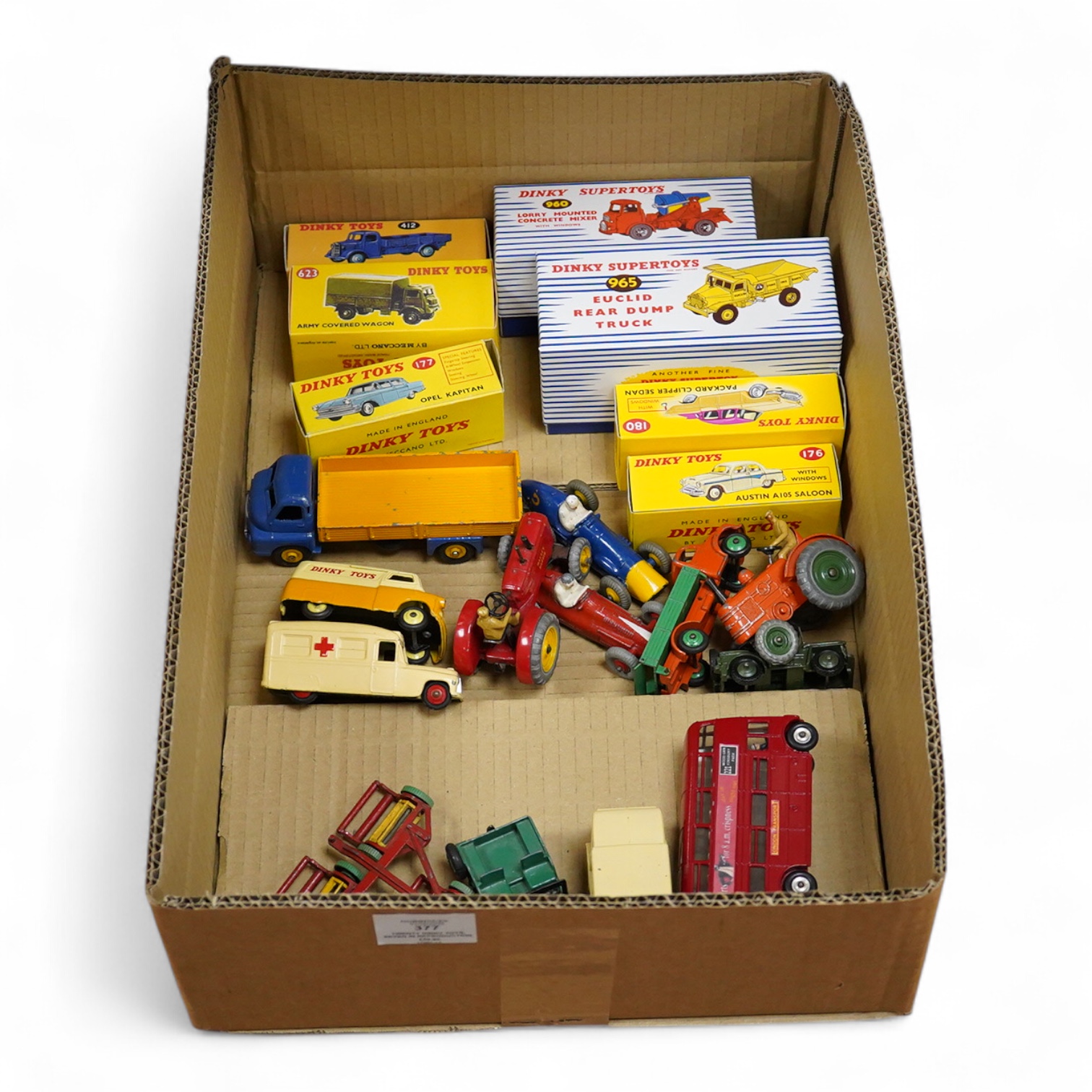 Twenty Dinky Toys, seven in reproduction boxes, including; Opel Kapitan, Austin A105 saloon, Packard Clipper Sedan, Euclid rear dump truck, Daimler ambulance, NCB electric van, etc.